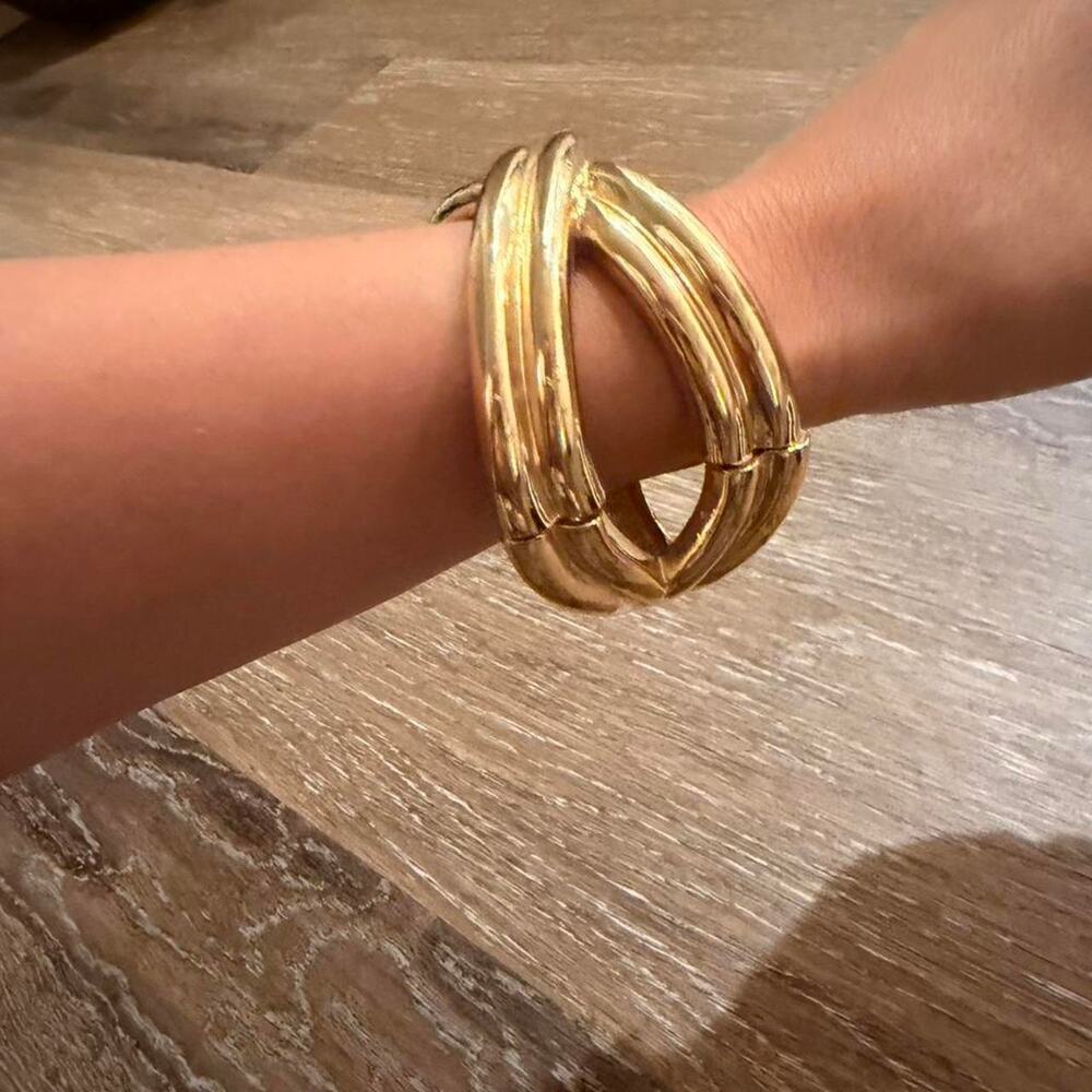 Gold tone twisted bangle bracelet